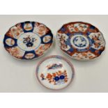 Two 19th Century Chinese porcelain Imari scalloped shaped dishes, one with central vase of flowers,