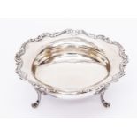 Silver tri-footed bowl with fitted edge, total gross weight 7.