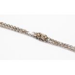 An 18ct white gold bracelet, textured link A/F set with five brilliant diamonds to the front,