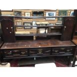 An 18th century and later oak dresser and rack, joined construction,