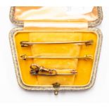 Three Asprey safety pins,