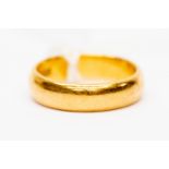 A 22ct gold band, size K, weight 4.