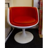 A 1960's laminated space chair with orange upholstery. Condition: Wear to fabric and marks to