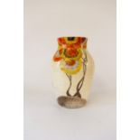 A Clarice Cliff vase decorated with sunflowers. Height 25cm