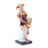 A Royal Doulton jester figure, with Royal Doulton monogram and dated 1948. Height 25cm