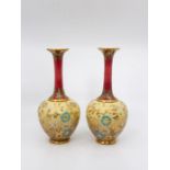 Pair of Doulton Lambeth vases, red/ gold. Ht 27cm