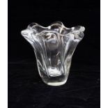 A Daum France clear glass vase of organic form. Heavy weighted base. Incised Daum signature at base.