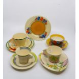 Clarice Cliff: A Newport pottery Ravel trio, the conical cup with printed mark including ‘