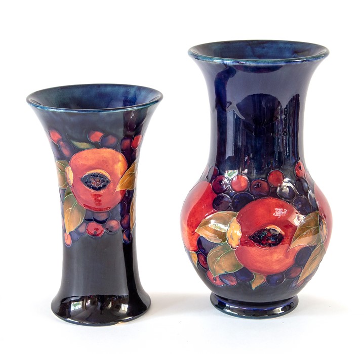 Pair of W Moorcroft pomegranate vases. W Moorcroft monogram and impressed marks. Condition: larger