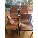 A set of mid 20th Century Danish rosewood chairs with leather seats and backs, comprising two carver