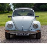 A 1984 Mexico VW Beetle, white livery with black tartan interior, sunroof, white wheels, 1300cc,