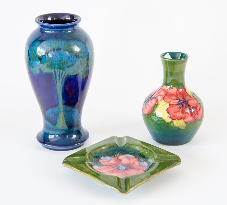 Moorcroft green ashtray, green vase and a blue vase (3) Condition: restoration to the rim of the