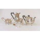 An Edwardian Art Nouveau five piece silver tea set, with ebony handles and finials to the teapot and
