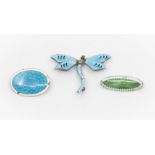 Three vintage guilloche enamel brooches comprising a dragonfly brooch and an oval brooch, with green