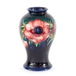 A Moorcroft anemone baluster vase, green, W M monogram and impressed marks. Height 16cm