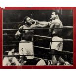 Boxing: A signed, framed and glazed picture of Muhammad Ali versus Joe Frazier, 'Thriller in