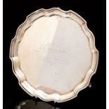 Golf: A George V silver salver, pie crust edge, raised on three scroll feet, presentation