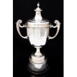 Angling: A hallmarked silver angling trophy, inscribed 'Presented to the Towcester & District