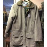 A Gentlemans Tweed Shooting Jacket by "Bronte". Size Large. All zips and press studs large.