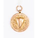 A 9ct rose gold medallion fob engraved to the edge J Buxton K S R H 84.4, weight approx 5.