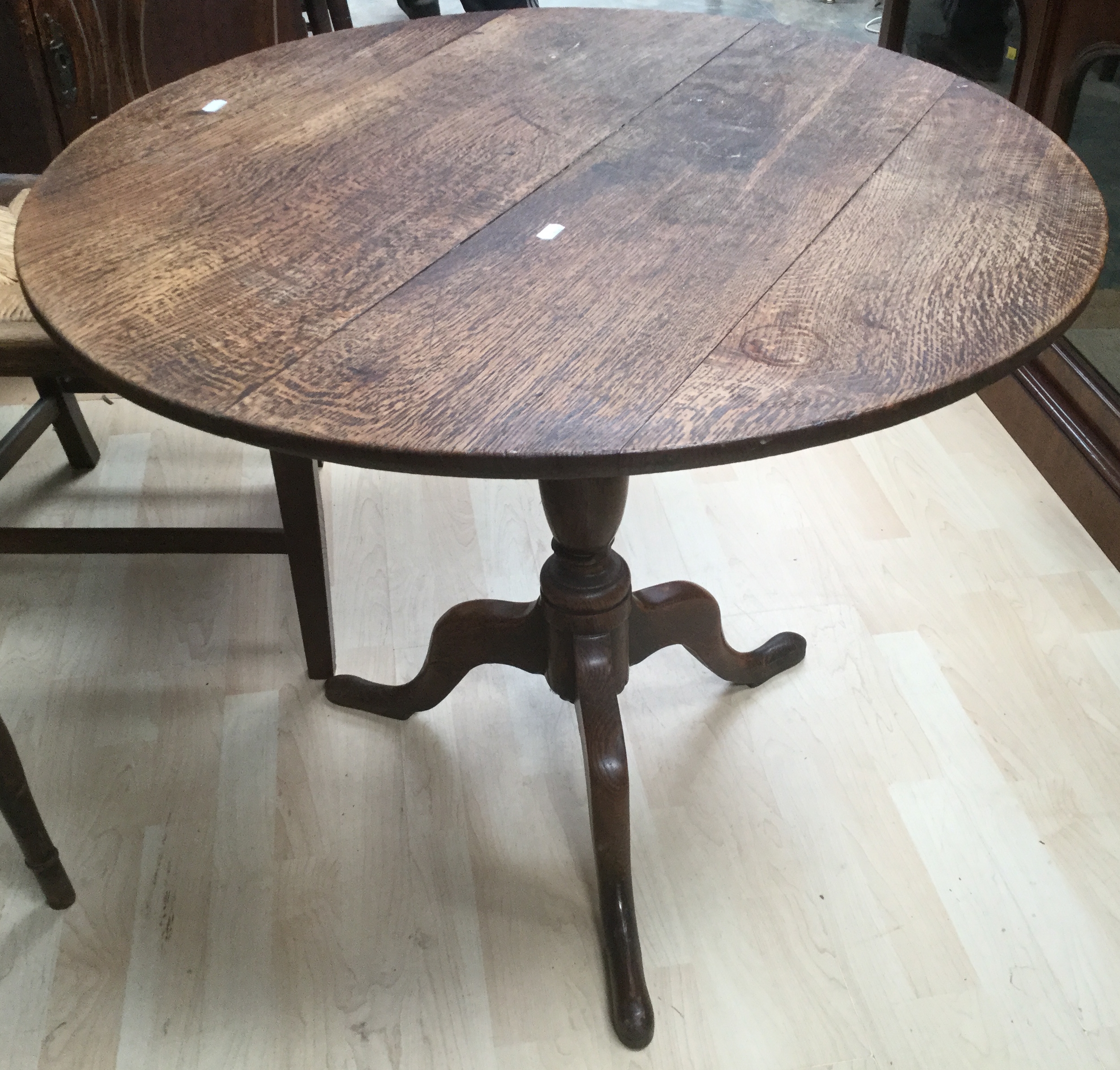 A George III oak tilt top table.