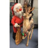 Large plush reindeer and Father Christmas