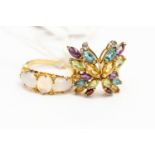 An opal and diamond ring, set in unmarked 18ct gold, size O, total gross weight approx 4 gms,