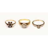 Two 18ct gold diamond set rings, including a diamond set cluster with bark effect band,