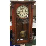 A late Victorian walnut eight day Vienna wall clock, the dial inscribed S&F,