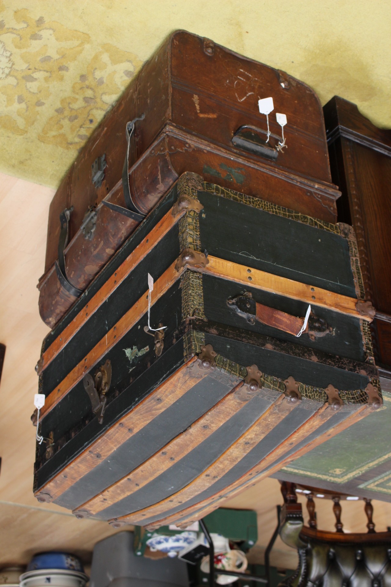 One wooden and metal domed shaped trunk and one metal trunk (2)