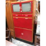 A 1950's Ladylove oak and red painted kitchen cabinet,