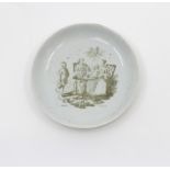 A Longton Hall saucer, printed by Sadler, The Tea Party, signed Sadler, Liverpool, circa 1758-60.