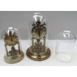 Two Anniversary clocks one with onyx base, Acctim and Haller, both with glass globes,