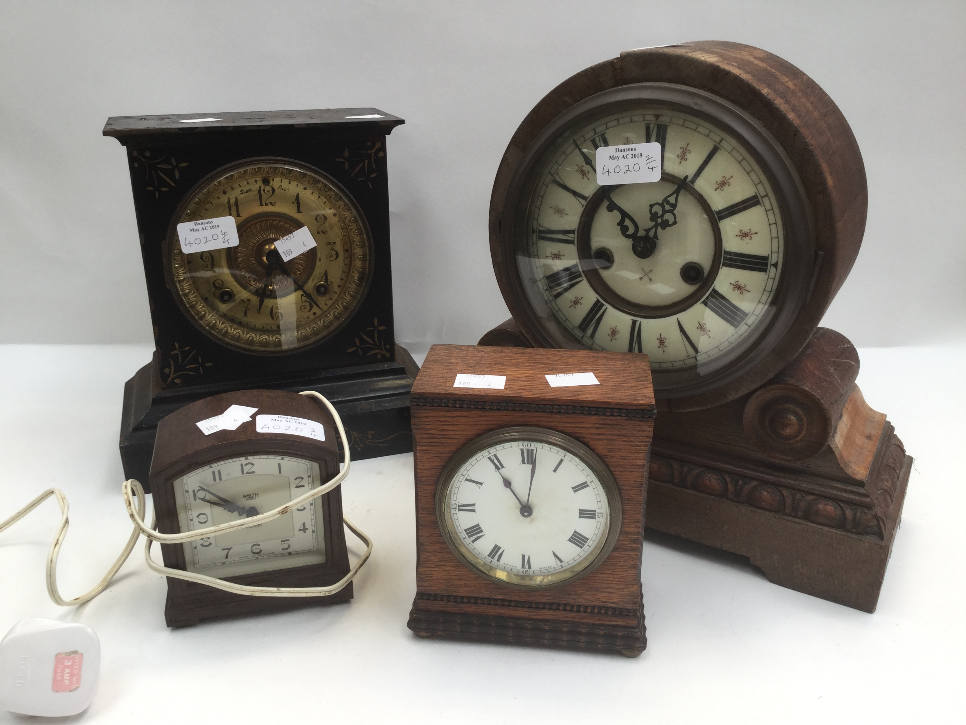 Four early 20th Century mantle clocks, one metal,