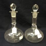 A pair of mid Victorian shaft and globe decanters,