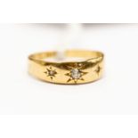 A diamond and 18ct gold ring, star set, size L1/2, total gross weight approx 2.