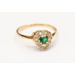 An 9ct gold cluster ring set with green and white stones, heart shaped detail, size K1/2,