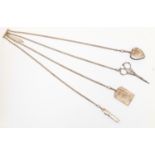A Victorian silver chatelaine comprising a heart shaped pin cushion, pocket knife,