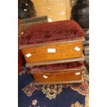 A pair of mahogany box foot stools,both having matching padded covers,bun feet.