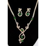 A diamond and emerald necklace, five cabochon emeralds claw set to grain set diamond scroll detail,
