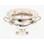 A Regency style silver plate wine cooler, rim chased with trailing flowers, foliage and shells,