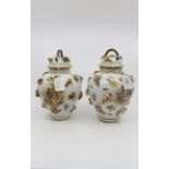 A pair of Dresden baluster shaped vases and domed covers,