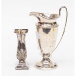A George VI urn shaped faceted silver cream jug 1946,