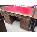 An Edwardian style mahogany twin pedestal desk,
