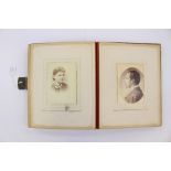 A large Victorian photograph album containing various photographs including W.