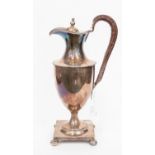 Silver plated Georgian style claret jug, with leather strapped handle on sq base,