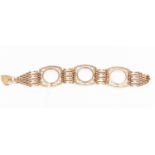 A 9ct gold three link coin mount bracelet, gate style links, weight approx 29.