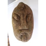A carved head of grotesque form - architectural salvage