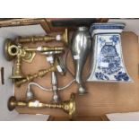 A selection of brass candlesticks, three pairs with a pewter jug, a plated candelabra,