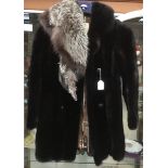 A collection of furs to include a black mink ¾ 1960/70's coat, damage under arms and under collar,